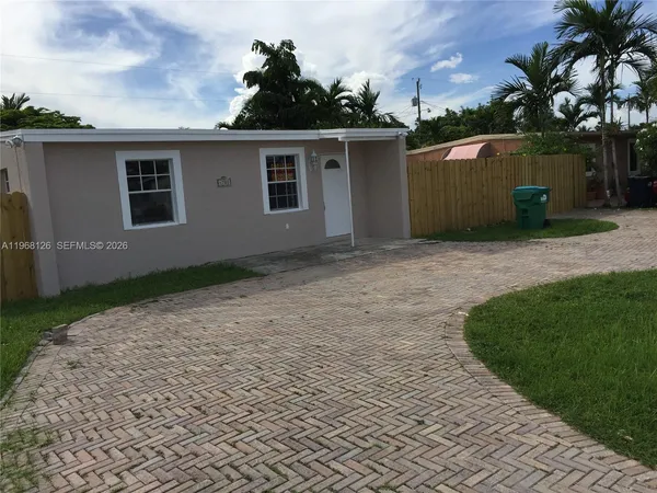 a view of backyard with a garden and plants