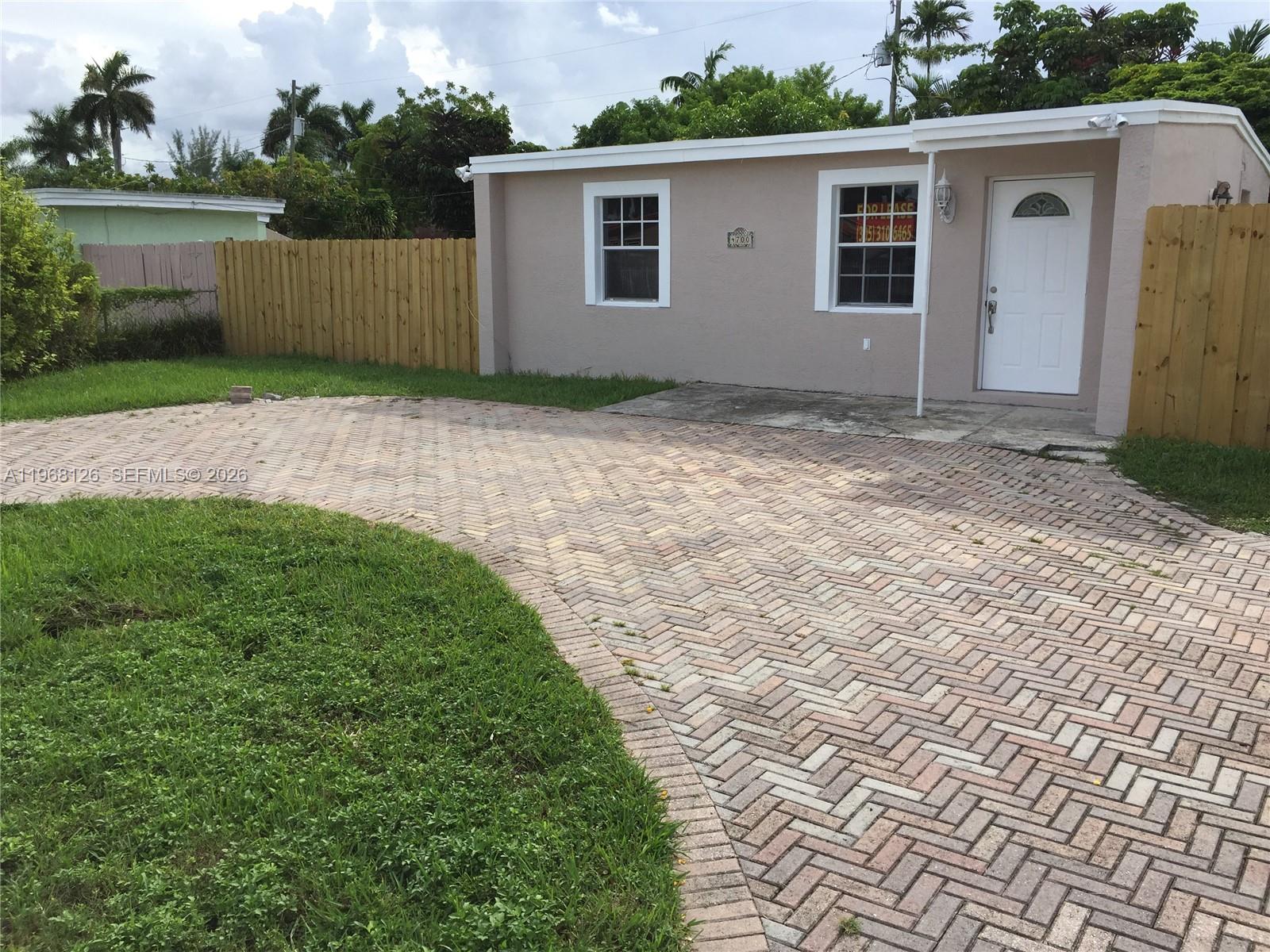 4700 Southwest 97th Avenue, Unit 4700 Miami, FL 33165 - Photo 2 of 9 a view of a house with a yard
