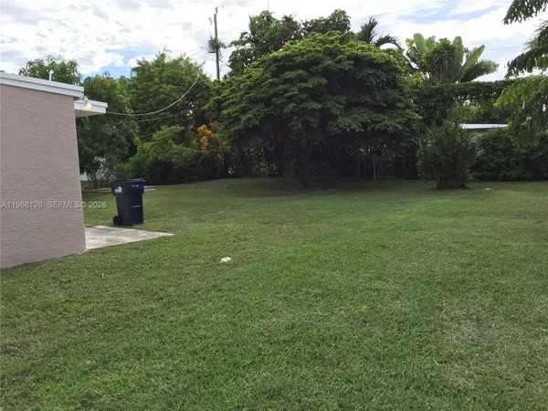 a backyard of a house with lots of green space