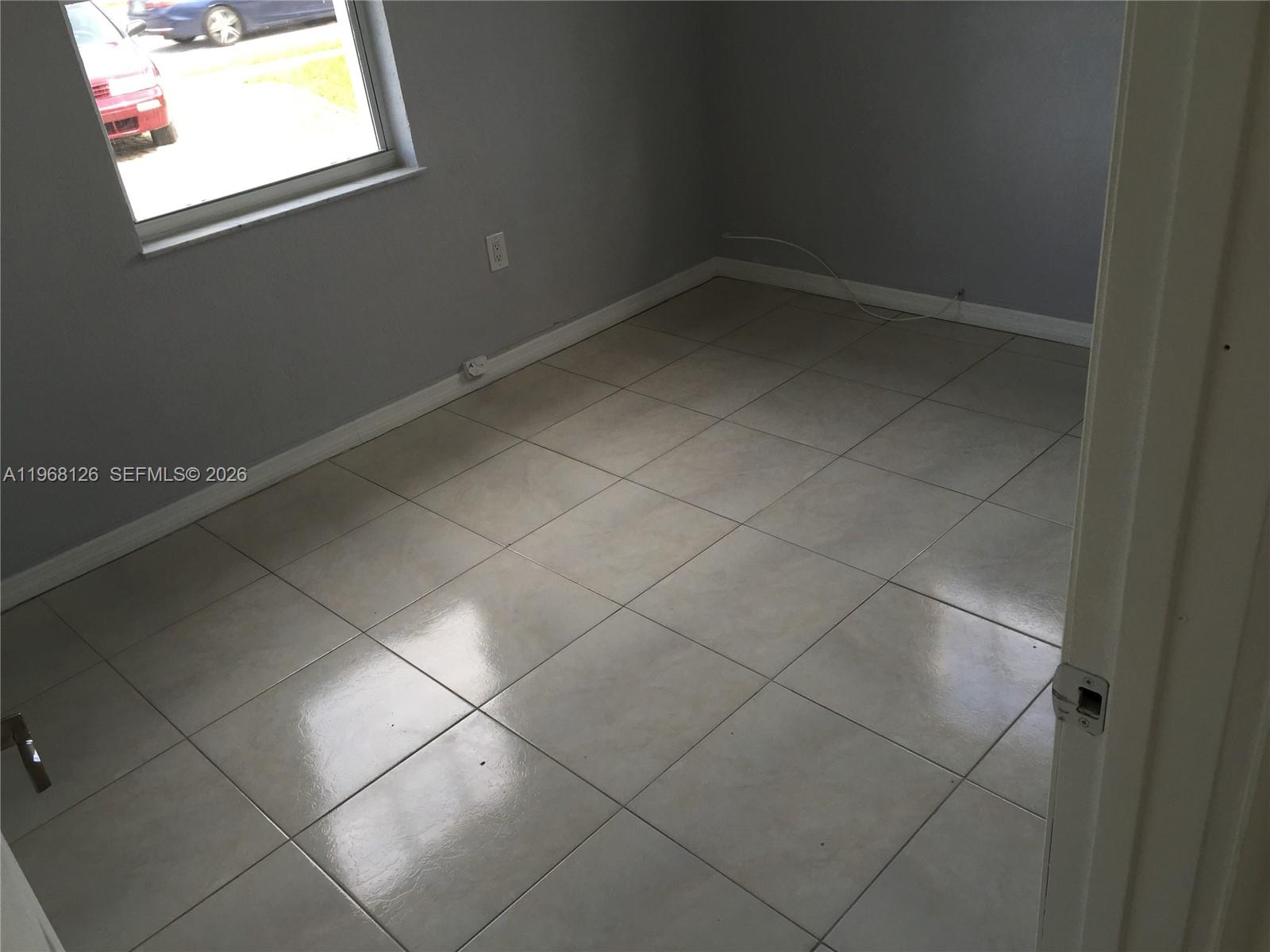 4700 Southwest 97th Avenue, Unit 4700 Miami, FL 33165 - Photo 7 of 9 a bathroom with a window