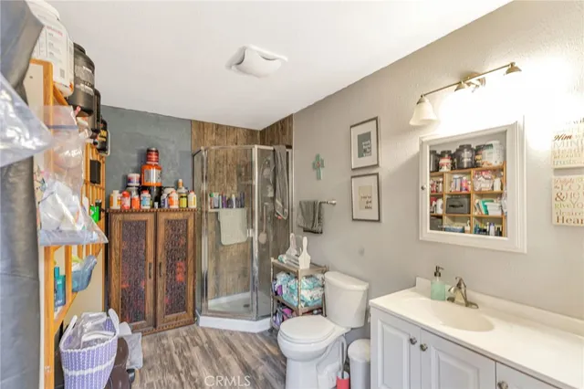 a bathroom with a sink a toilet and shower curtain