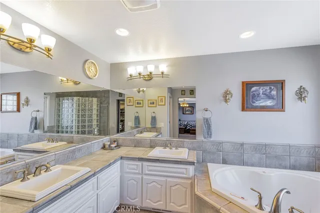 a bathroom with a sink mirror vanity and toilet