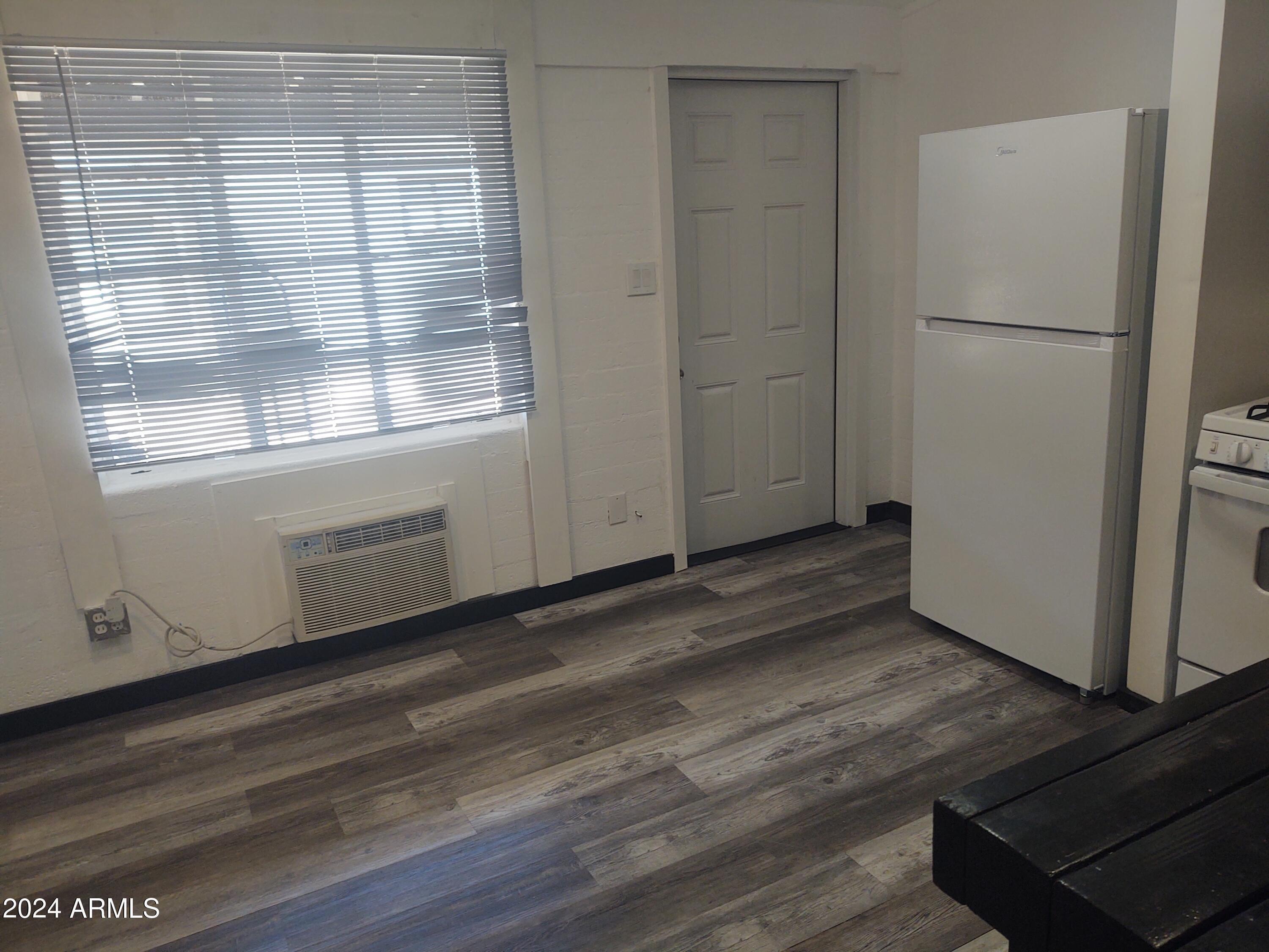 1625 East Pinchot Avenue Phoenix, AZ 85016 - Photo 4 of 6 a view of a kitchen with wooden floor and electronic appliances