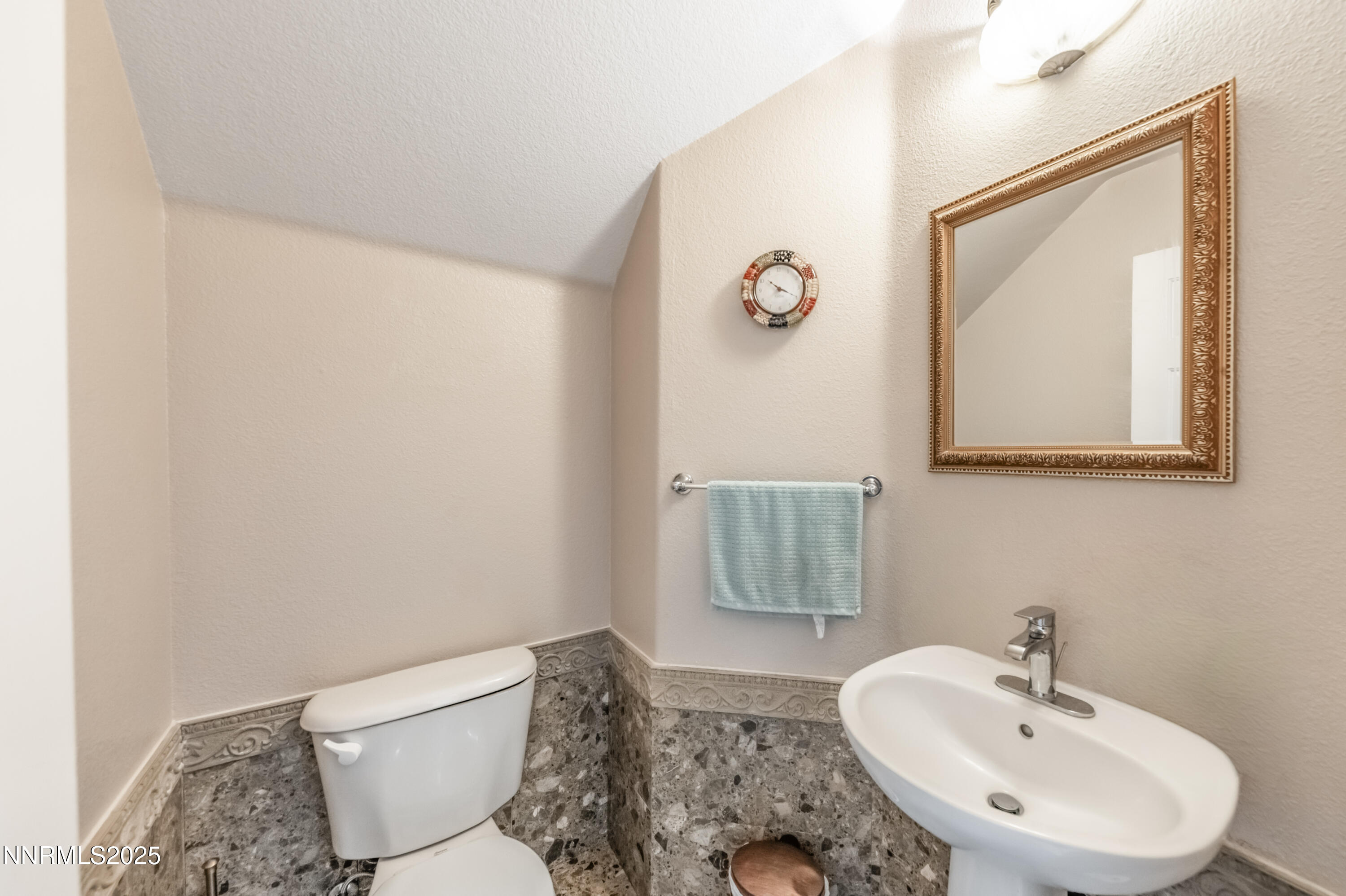 5722 Golden Eagle Drive Reno, NV 89523 - Photo 14 of 32 a bathroom with a sink and a mirror