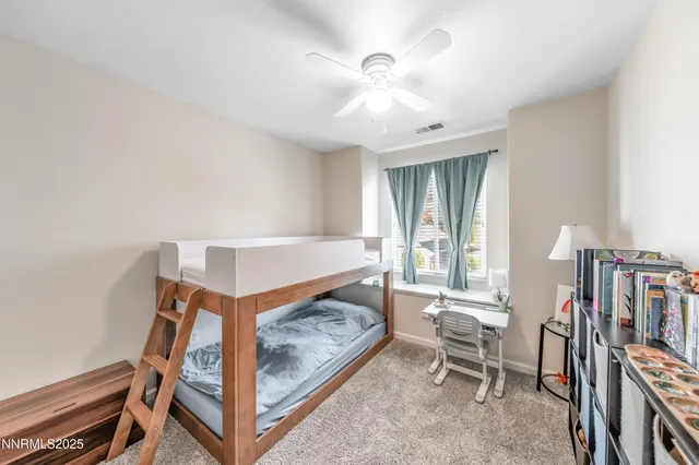 a bedroom with furniture and a window