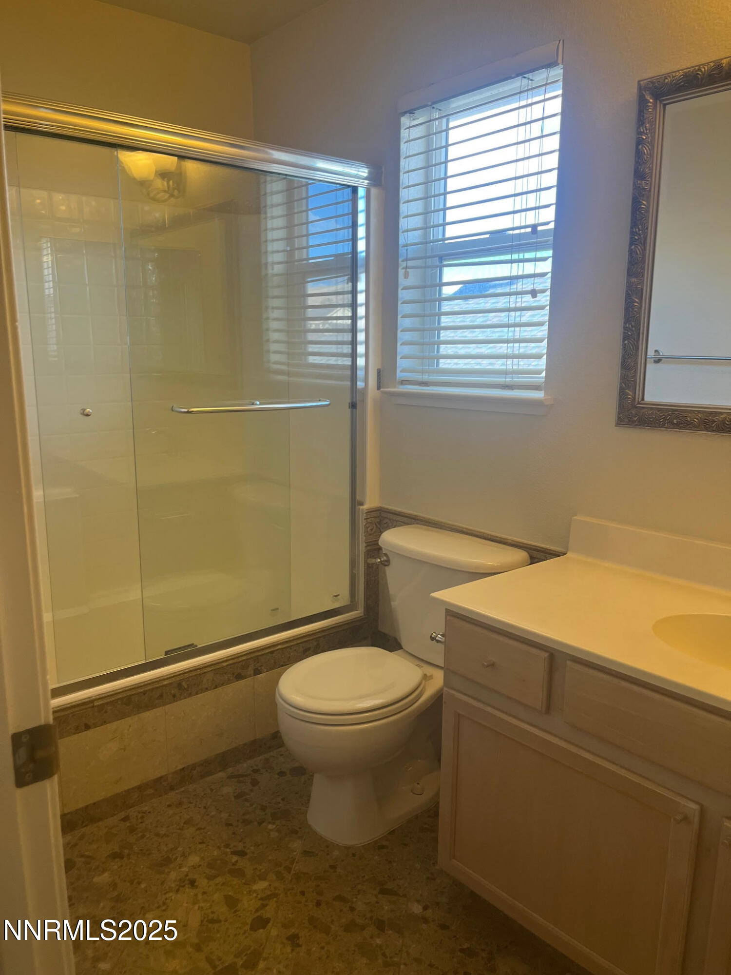 5722 Golden Eagle Drive Reno, NV 89523 - Photo 25 of 32 a bathroom with a granite countertop sink toilet and shower