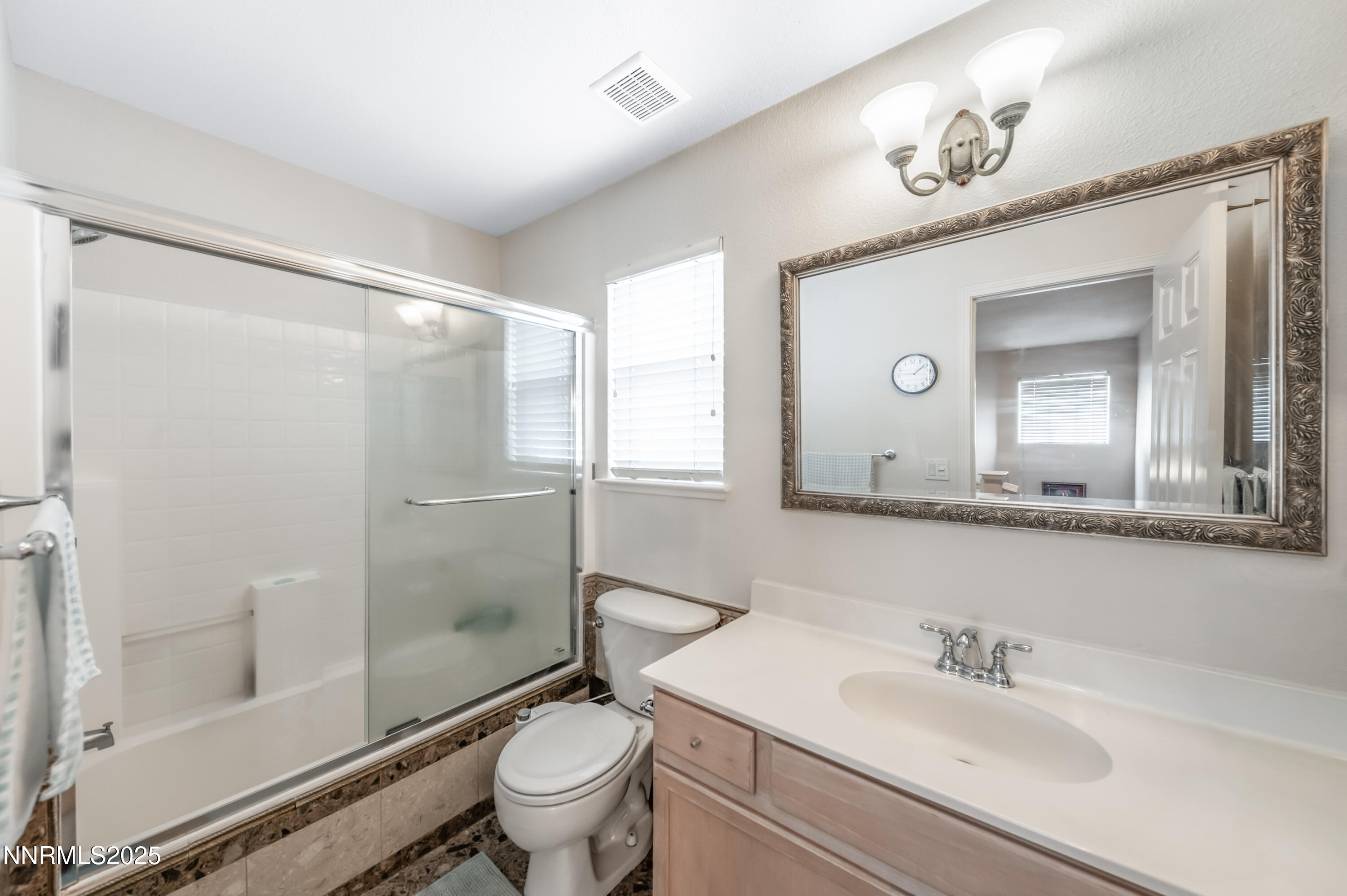 5722 Golden Eagle Drive Reno, NV 89523 - Photo 27 of 32 a bathroom with a sink a toilet and shower
