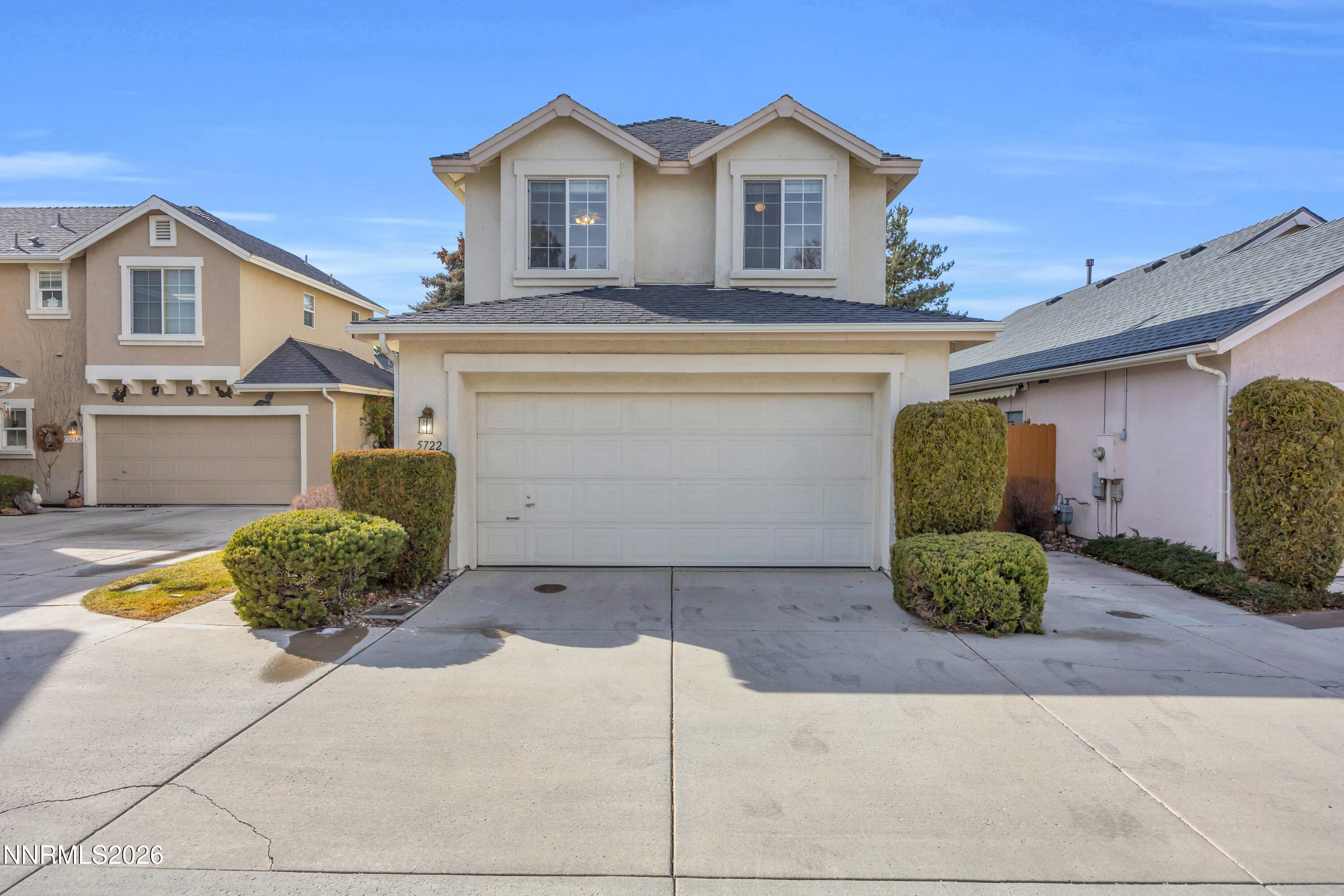 5722 Golden Eagle Drive Reno, NV 89523 - Photo 4 of 5 a front view of a house with potted plants