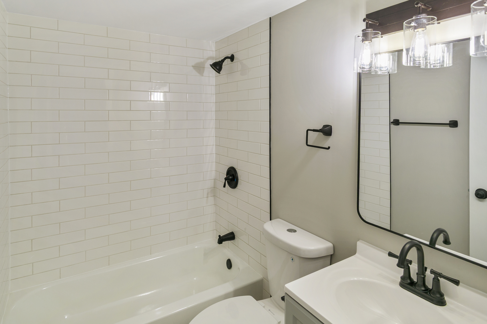 6305 Robert Road Cary, IL 60013 - Photo 11 of 24 a bathroom with a sink a toilet and shower