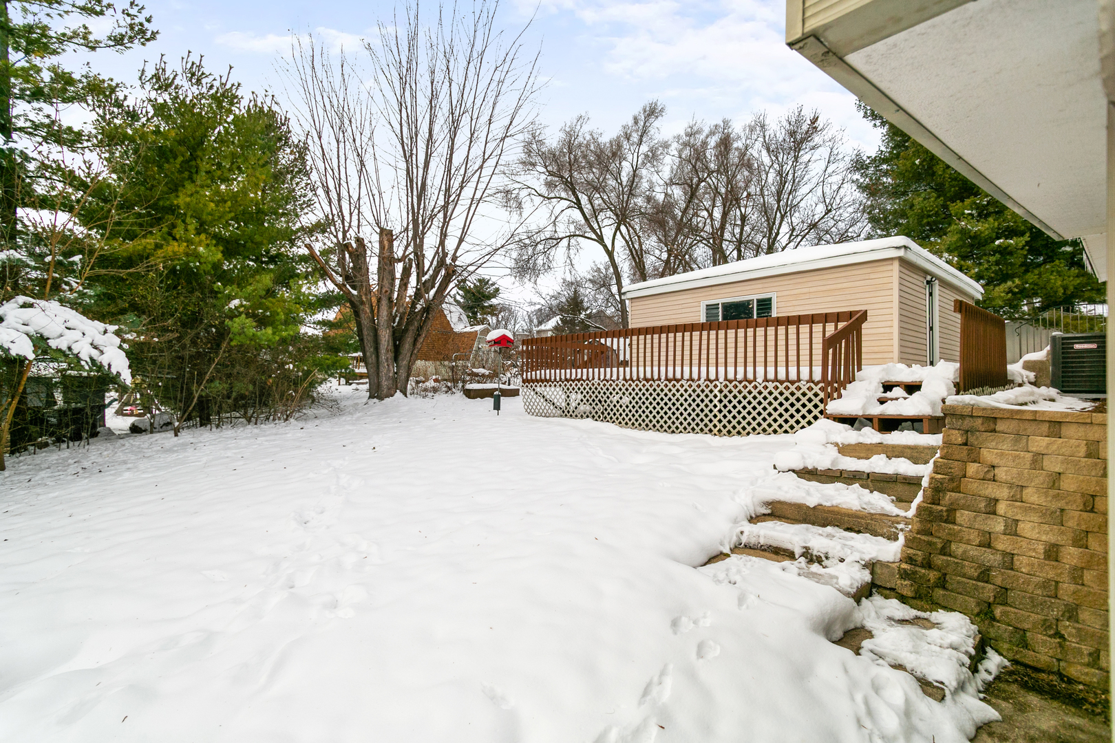 6305 Robert Road Cary, IL 60013 - Photo 3 of 24 a view of a house with a snow in the yard
