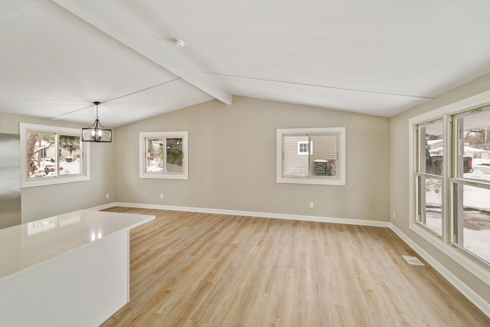 6305 Robert Road Cary, IL 60013 - Photo 8 of 24 a view of an empty room with a window and wooden floor
