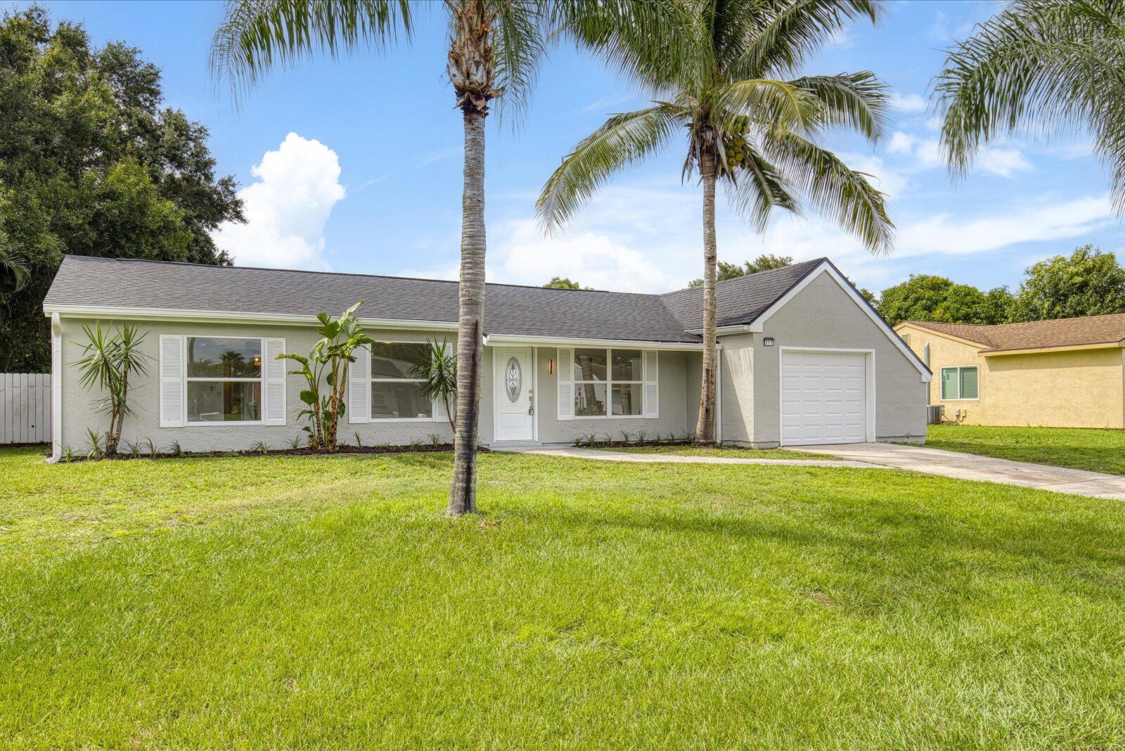 317 Southwest Kentwood Road Port St. Lucie, FL 34953 - Photo 4 of 32 FRONT