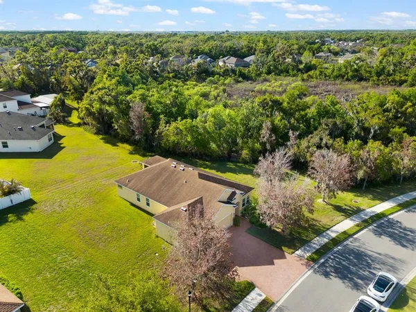 an aerial view of residential houses with outdoor space