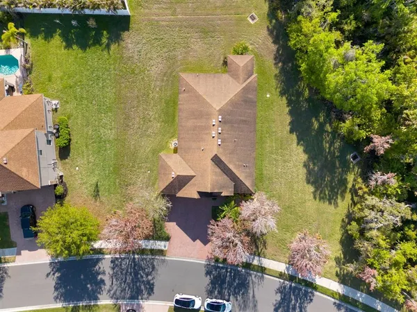 an aerial view of a house with a lake view