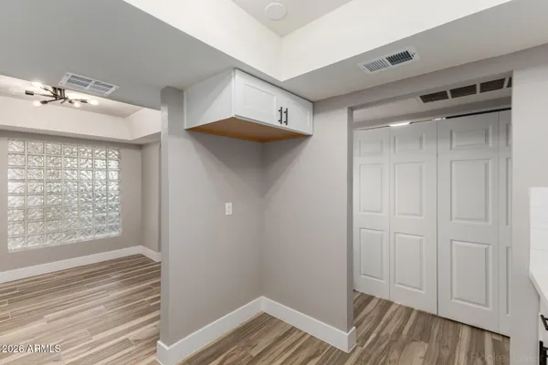 a view of a room that has a bed and a window in it