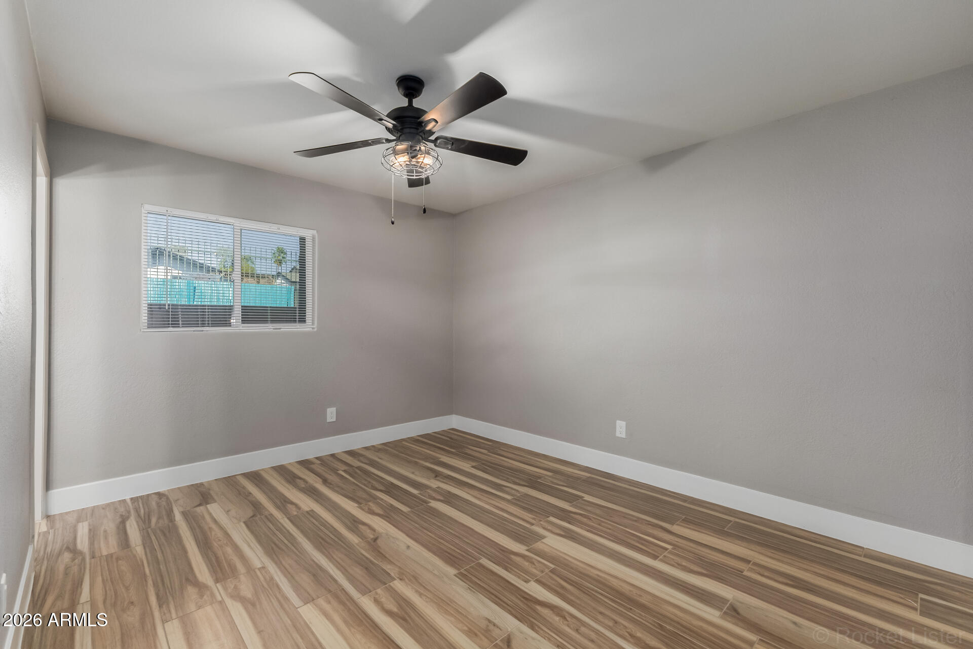 214 East Ruth Avenue, Unit 109 Phoenix, AZ 85020 - Photo 14 of 26 a view of room with window and ceiling fan