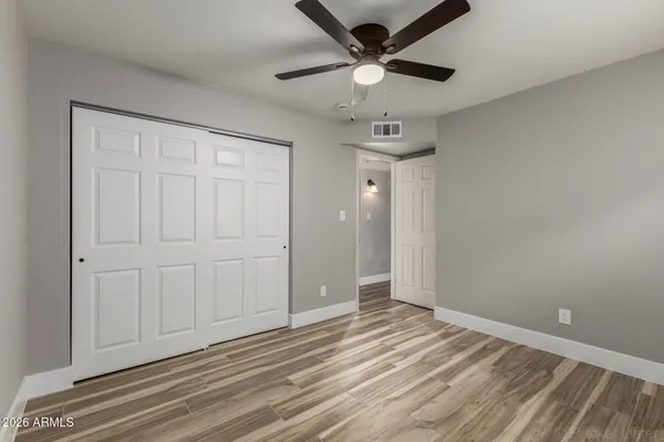 a bathroom with a toilet a sink and a mirror