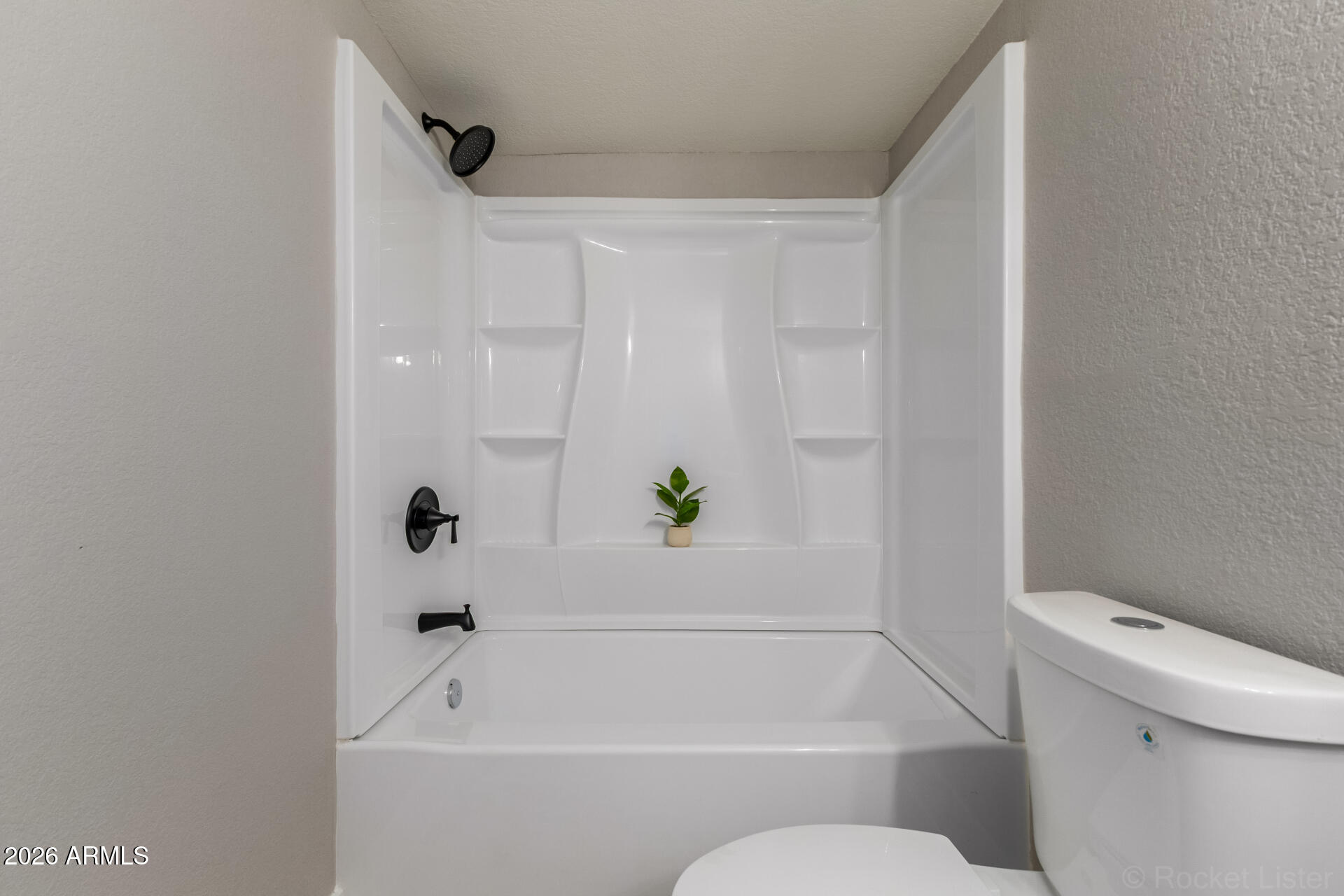 214 East Ruth Avenue, Unit 109 Phoenix, AZ 85020 - Photo 21 of 26 a bathroom with a bathtub and a shower