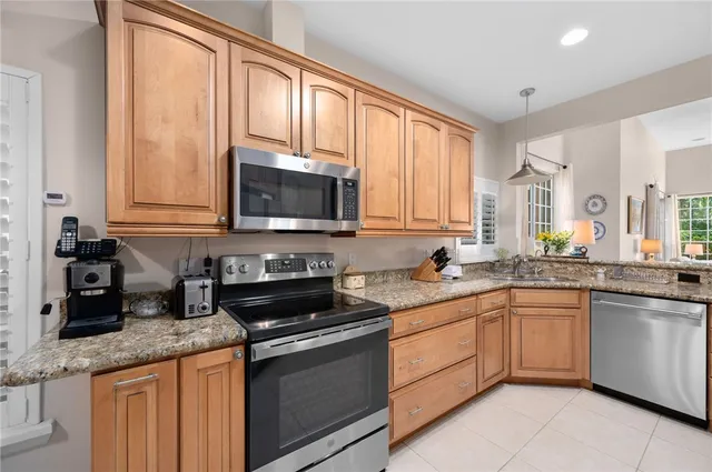 a bathroom with a granite countertop double sink and a mirror