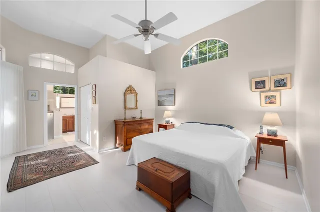 a bedroom with a bed and a table in it