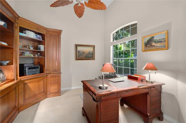 a workspace with furniture and book shelf