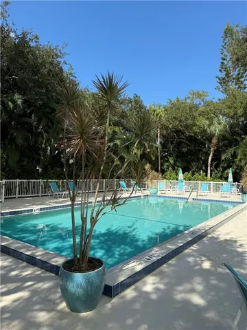 a view of balcony with wooden fence