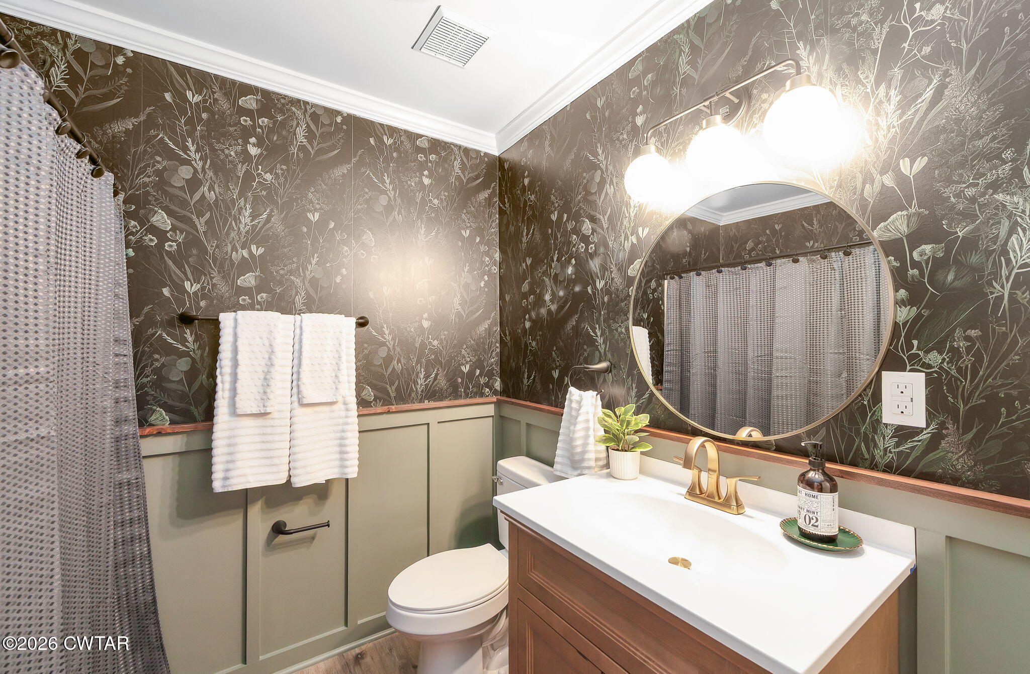 28 Mt Orange Road Trenton, TN 38382 - Photo 16 of 31 a bathroom with a sink toilet and mirror