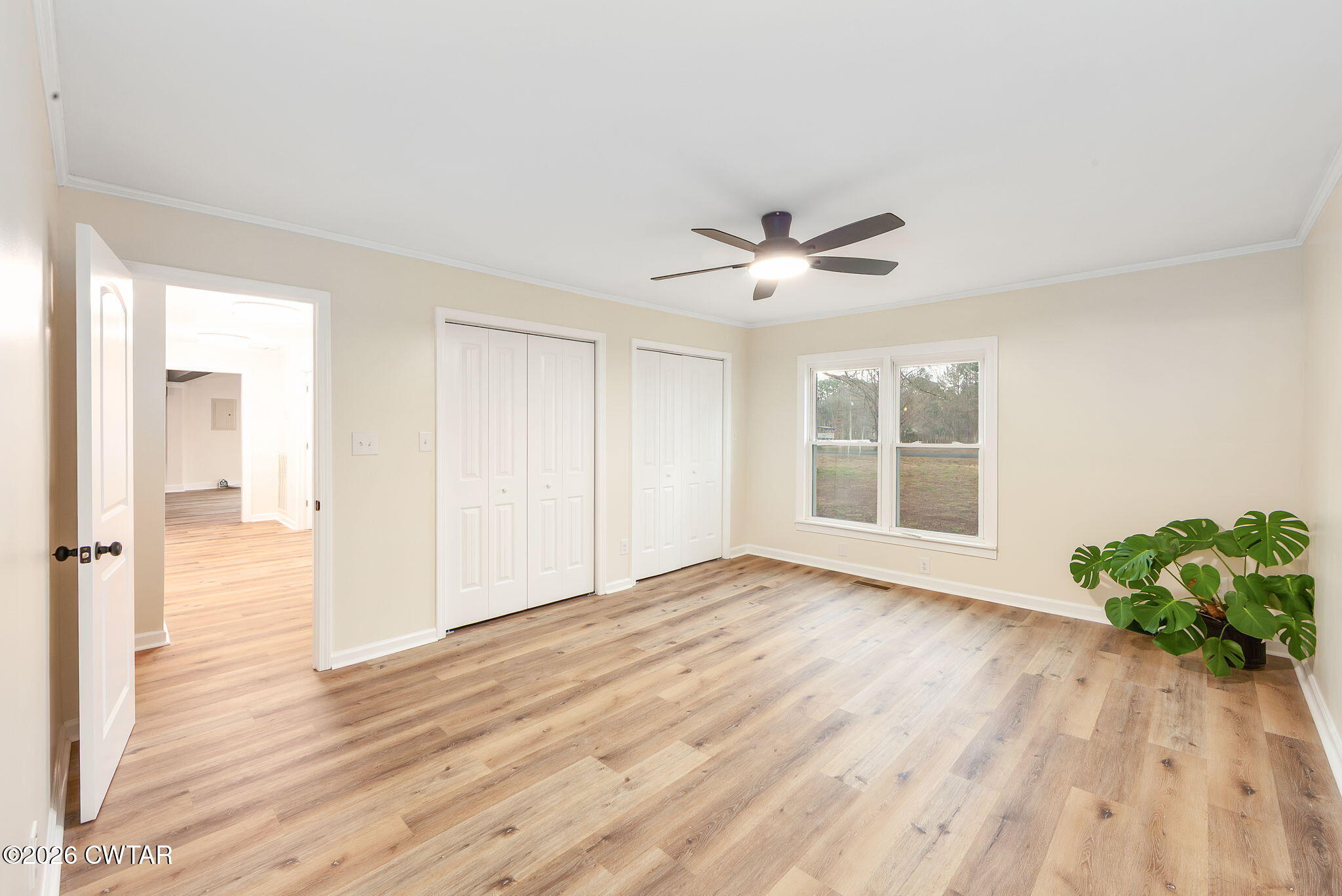 28 Mt Orange Road Trenton, TN 38382 - Photo 19 of 31 a view of an empty room with wooden floor and a window