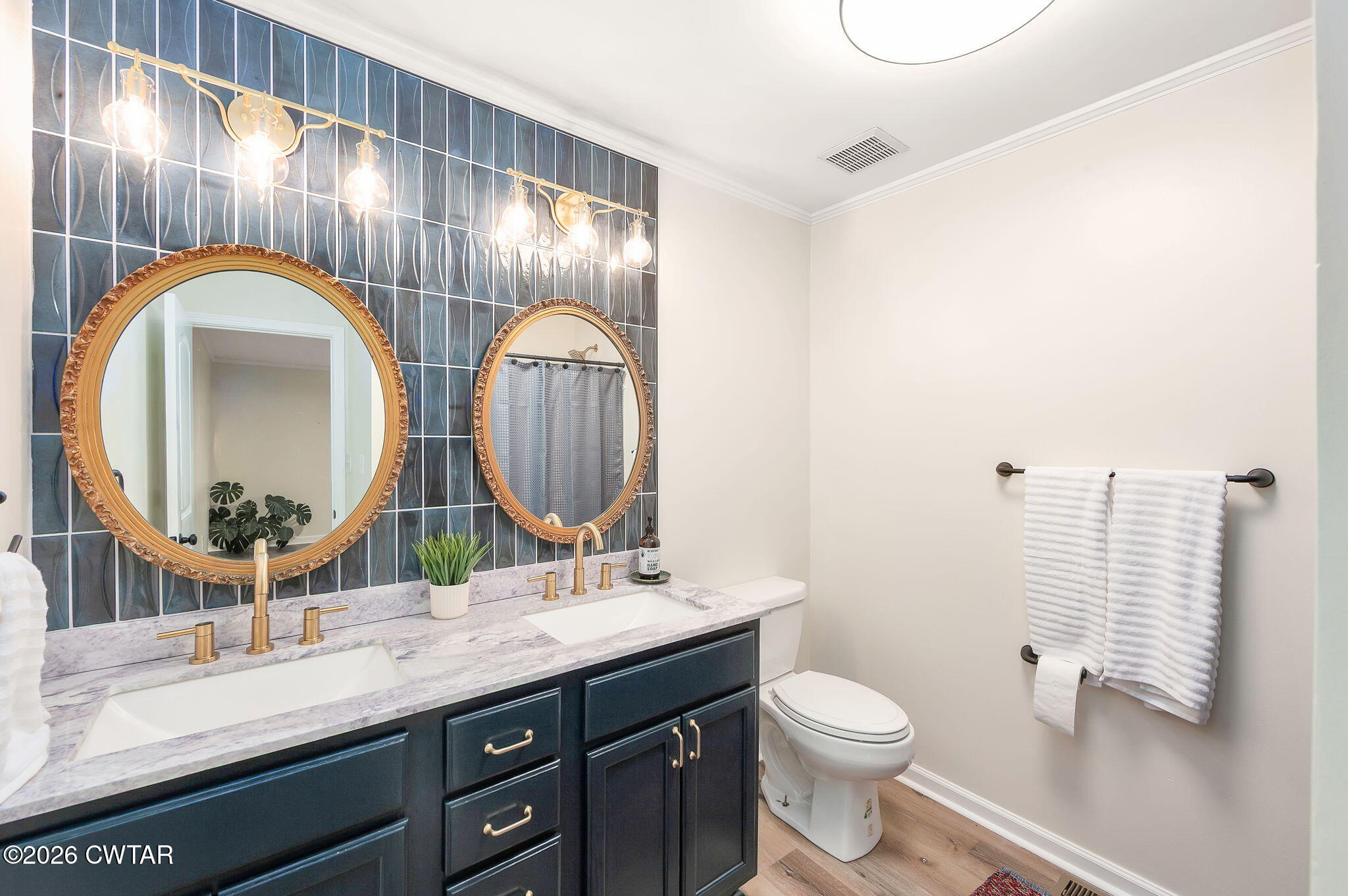28 Mt Orange Road Trenton, TN 38382 - Photo 21 of 31 a bathroom with double vanity and a mirror