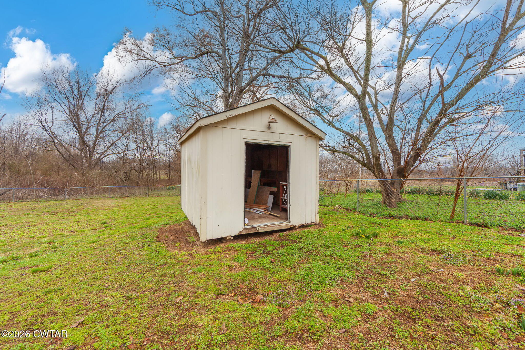 28 Mt Orange Road Trenton, TN 38382 - Photo 26 of 31 a yellow house with a big yard and large trees