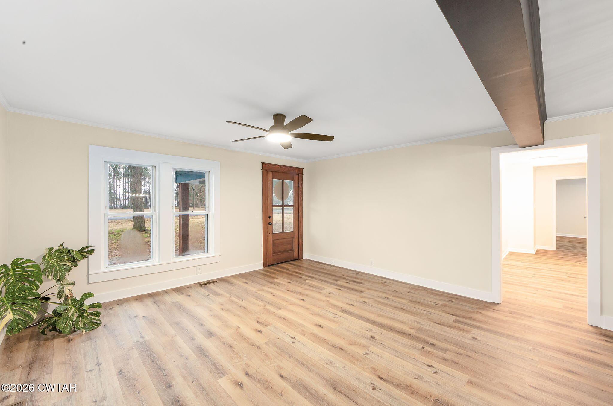 28 Mt Orange Road Trenton, TN 38382 - Photo 6 of 31 a view of an empty room with wooden floor and a window