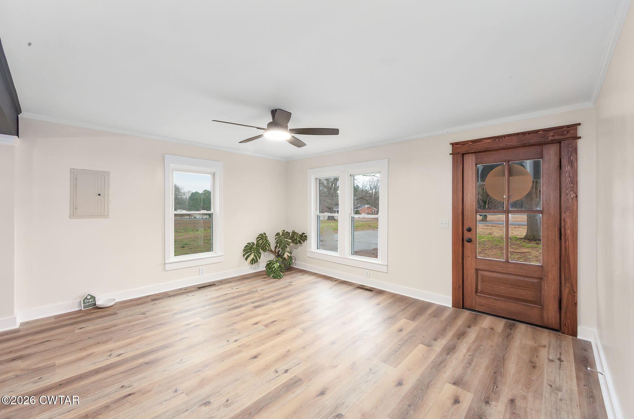 28 Mt Orange Road Trenton, TN 38382 - Photo 7 of 31 a view of an empty room with a window and wooden floor