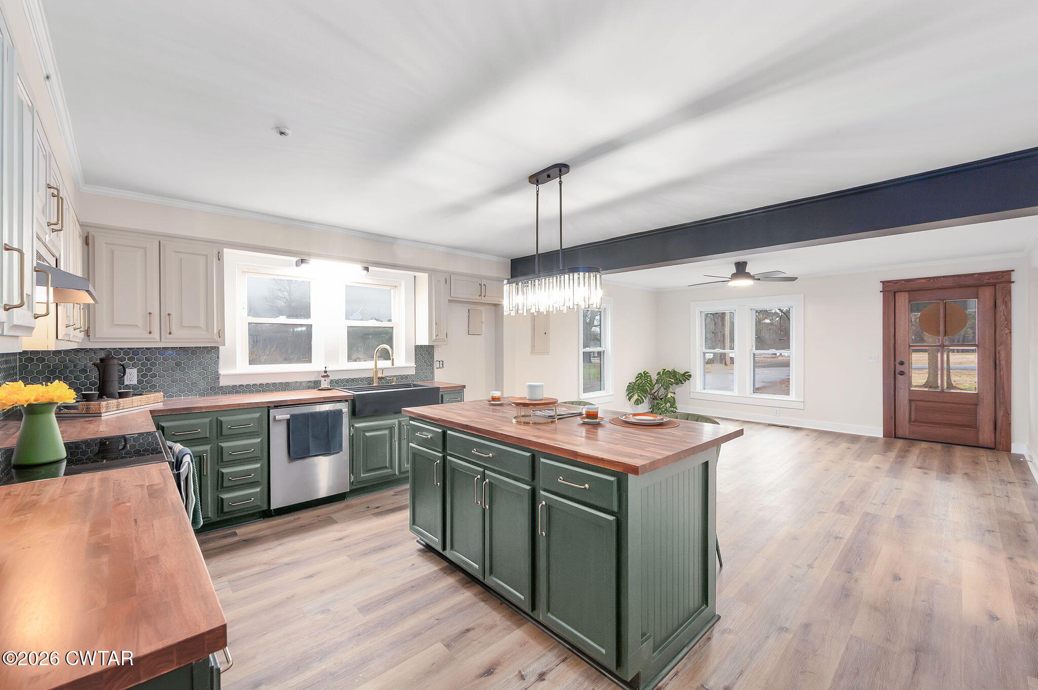 28 Mt Orange Road Trenton, TN 38382 - Photo 10 of 31 a kitchen with kitchen island granite countertop a sink stove and wooden cabinets