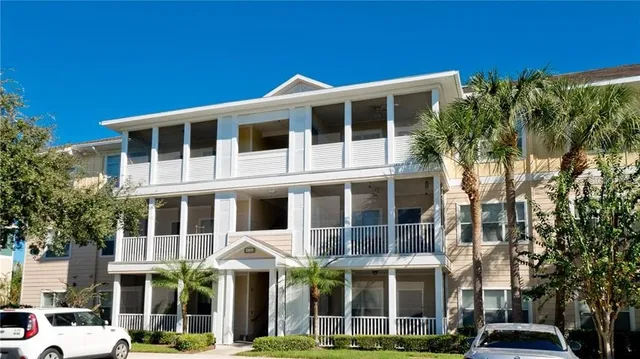 a front view of a building with a garden
