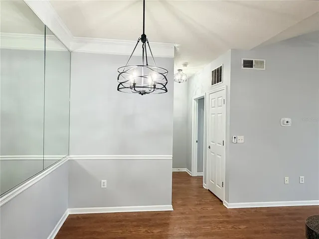a bathroom with a shower and a glass door