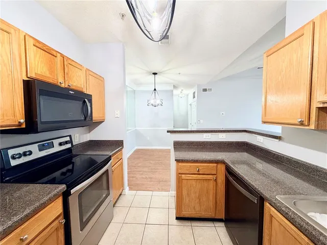 a white toilet sitting next to a bath tub