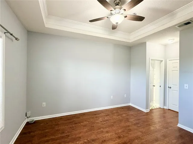 a view of a house with swimming pool and sitting area