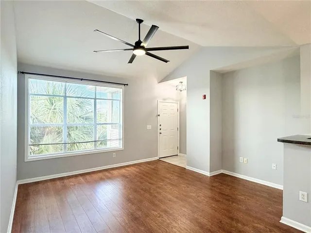 a view of a kitchen with a sink and cabinets