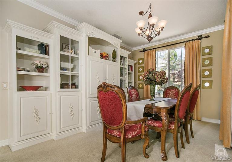 239 Knoll Ridge Road Simi Valley, CA 93065 - Photo 11 of 61 a dining room with furniture a chandelier and a rug