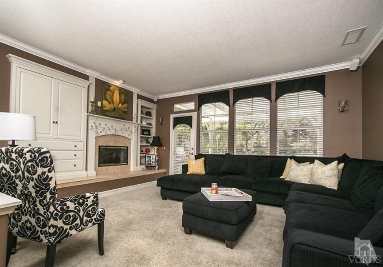239 Knoll Ridge Road Simi Valley, CA 93065 - Photo 18 of 61 a living room with furniture large window and a fireplace