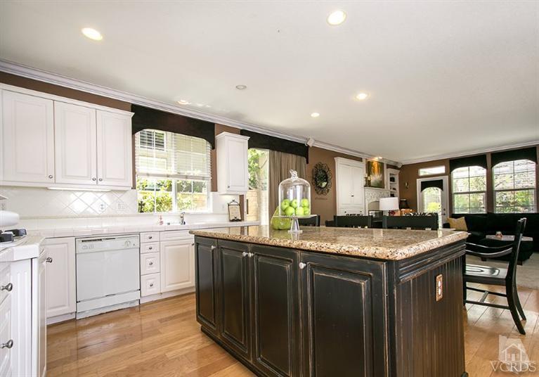 239 Knoll Ridge Road Simi Valley, CA 93065 - Photo 23 of 61 a kitchen with granite countertop sink stove and cabinets