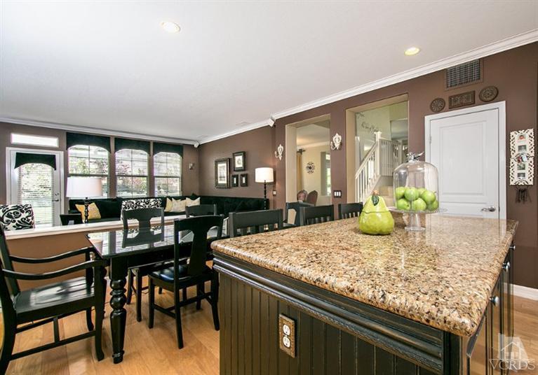 239 Knoll Ridge Road Simi Valley, CA 93065 - Photo 25 of 61 a kitchen with a table and chairs in it