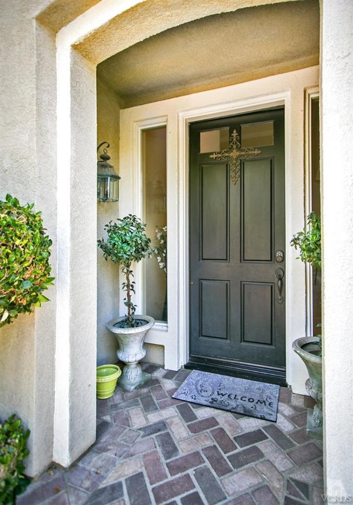 239 Knoll Ridge Road Simi Valley, CA 93065 - Photo 5 of 61 a front view of a house with a chairs and table chair