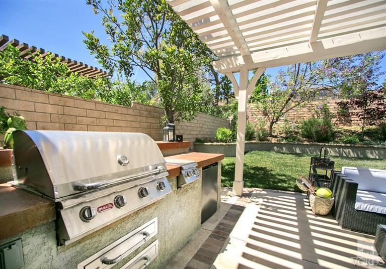 239 Knoll Ridge Road Simi Valley, CA 93065 - Photo 45 of 61 a view of a patio with a table chairs and a barbeque