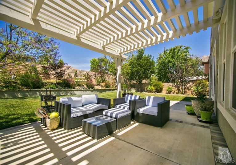 239 Knoll Ridge Road Simi Valley, CA 93065 - Photo 46 of 61 a view of a patio with couches table and chairs and potted plants
