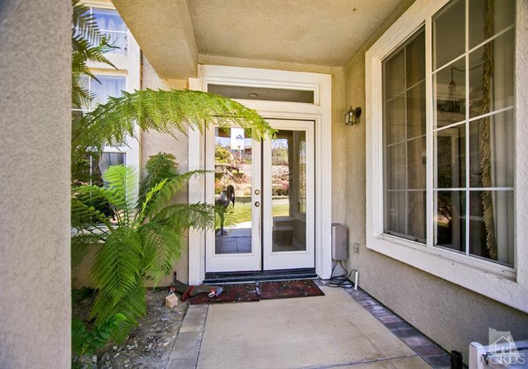 239 Knoll Ridge Road Simi Valley, CA 93065 - Photo 49 of 61 a view of a door with a potted plant