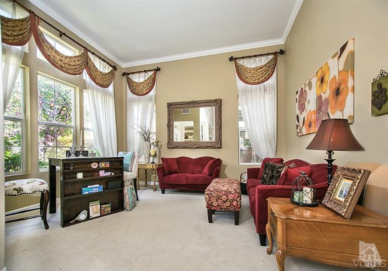 239 Knoll Ridge Road Simi Valley, CA 93065 - Photo 8 of 61 a living room with furniture and a flat screen tv