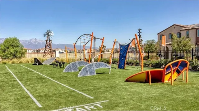 a view of a playground with basketball court