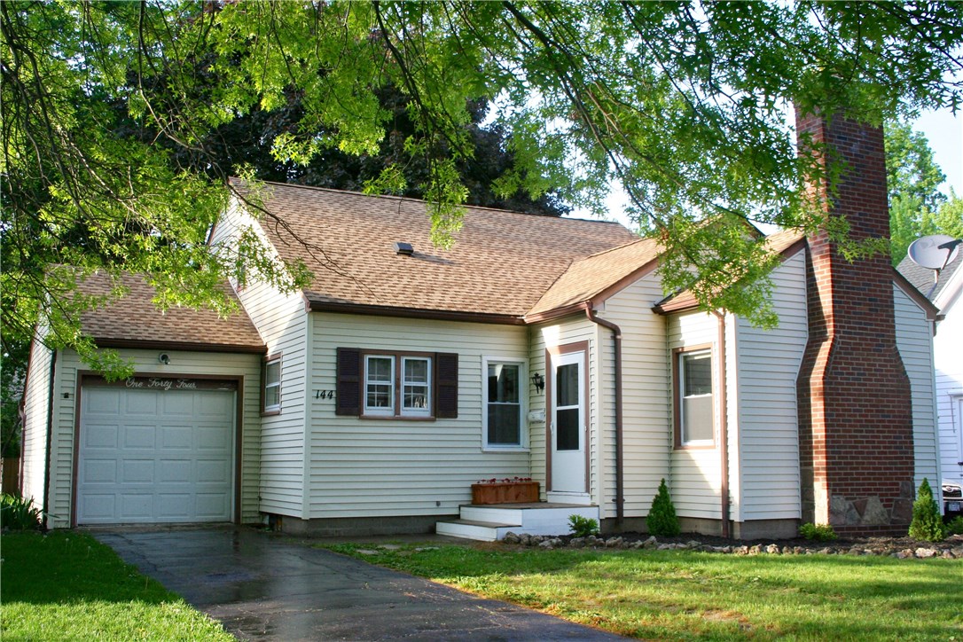 144 Thornton Road Irondequoit, NY 14617 - Photo 1 of 1 Front of house. Mature trees all around.