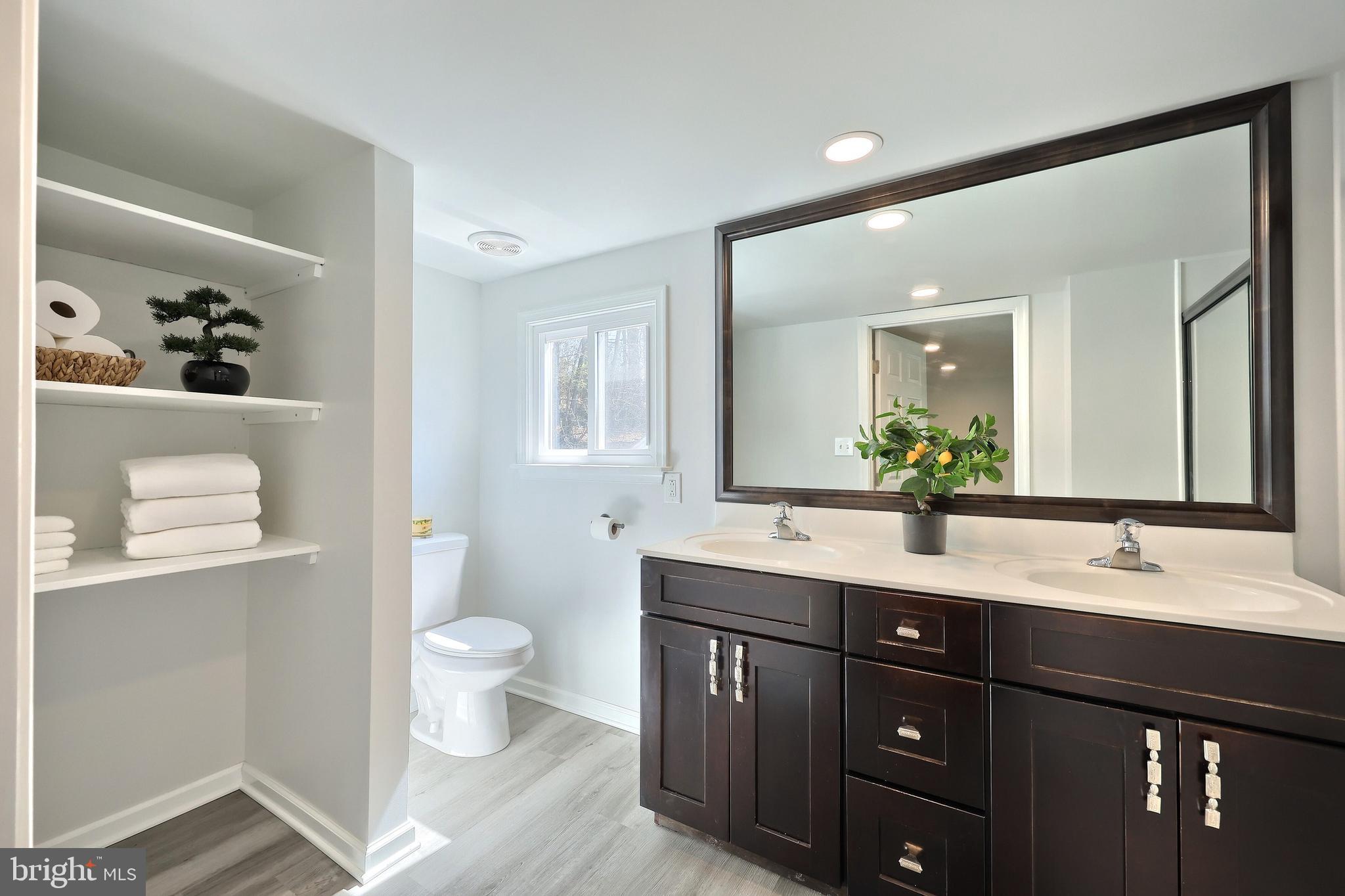 1320 Erney Road Dover, PA 17315 - Photo 26 of 35 a bathroom with a double vanity sink toilet and a mirror